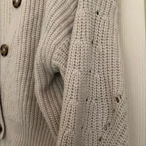 Nude cardigan with brown buttons